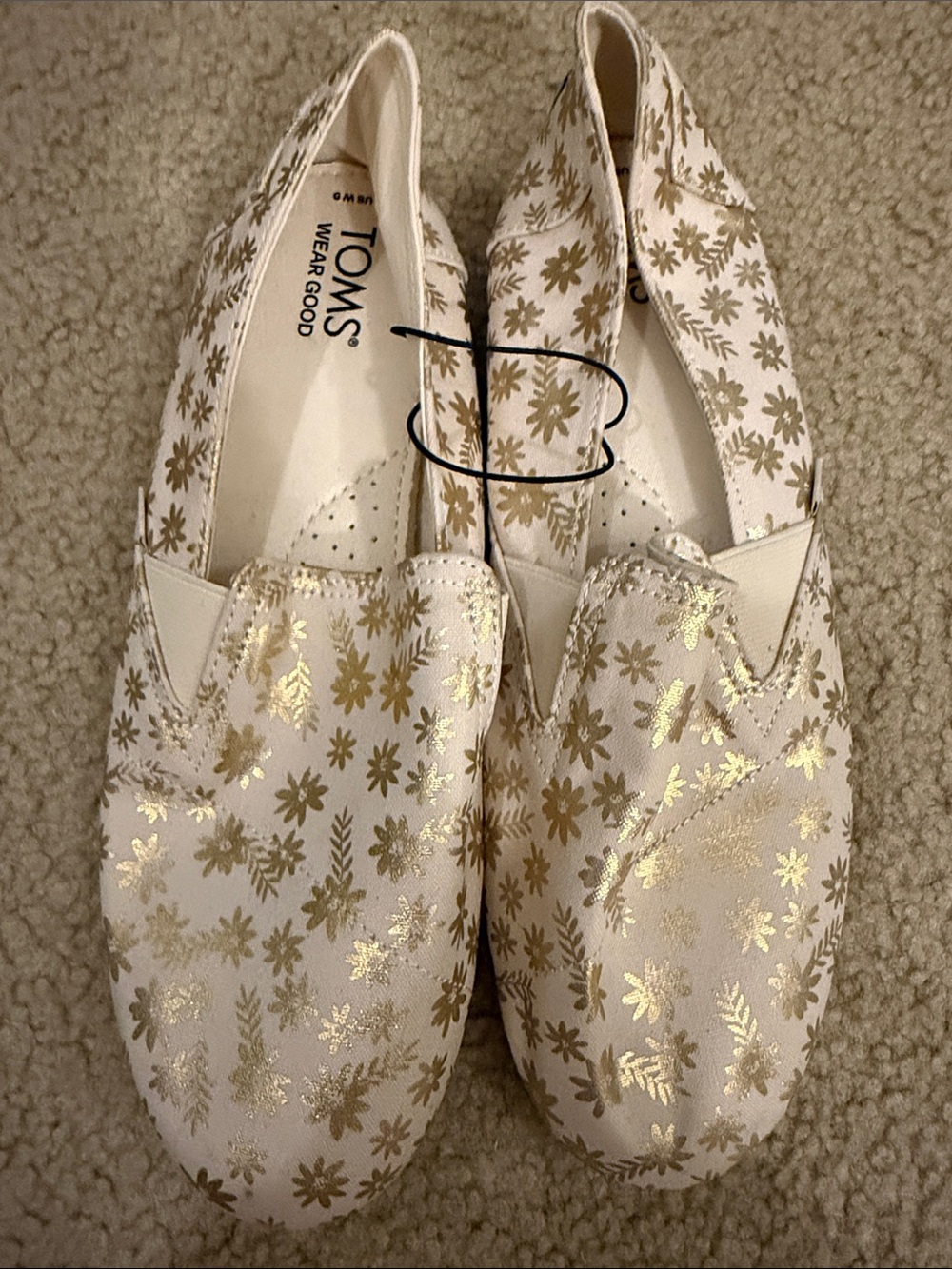 Toms Cream Slip-On Flats with Metallic Gold Floral Pattern